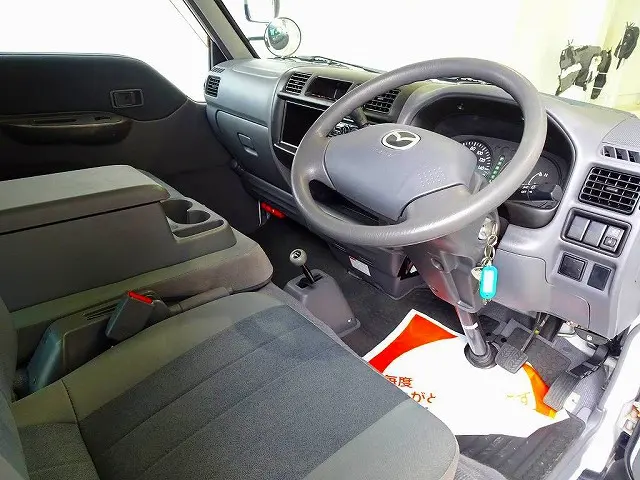 AC PS PW SRS ABS 集中ドアロック 左ミラー電動角度調整 CD AM/FMラジオ ETC リアガラス熱線 間仕切りビニールカーテン付 プライバシーガラス|マツダ ボンゴバン ABF-SKP2M(4WD)の写真5